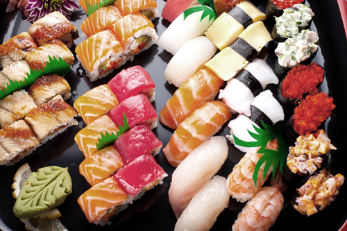 Traditional sushi platter arranged with nigiri and maki rolls